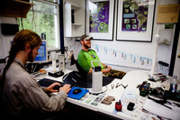 DeGroote and Blaine Cernes, a banding assistant, enter the data they've collected into a database that will help monitor how well the avian populations are doing in the wild.