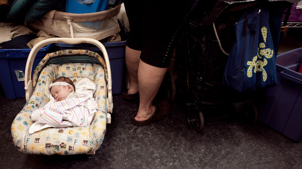 Zaniyah sleeps while her mom shops at the Bread for the City boutique.