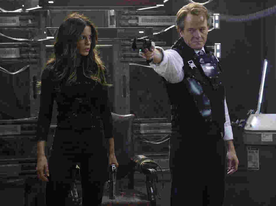 Lori (Kate Beckinsale) and Vilos (Bryan Cranston) are two enemies that come to light after Quaid visits Rekall.