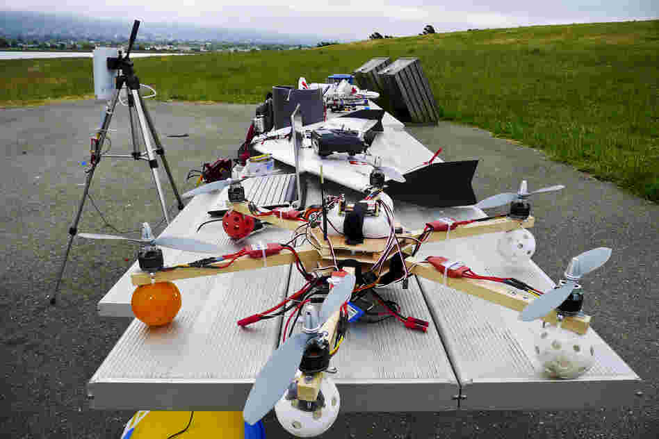 Hi-tech hobbyists Andreas Oesterer and Mark Harrison line up their homemade drones in Berkeley, Calif.