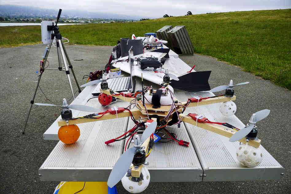 Hi-tech hobbyists Andreas Oesterer and Mark Harrison line up their homemade drones in Berkeley, Calif.