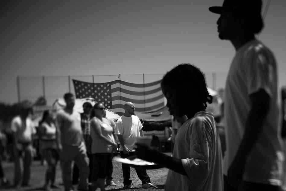 Homeless veterans, their families and volunteers line up for food at Stand Down, an annual event hosted by the Veterans Village of San Diego. The Veterans Administration estimates that 67,000 vets are homeless nationwide.