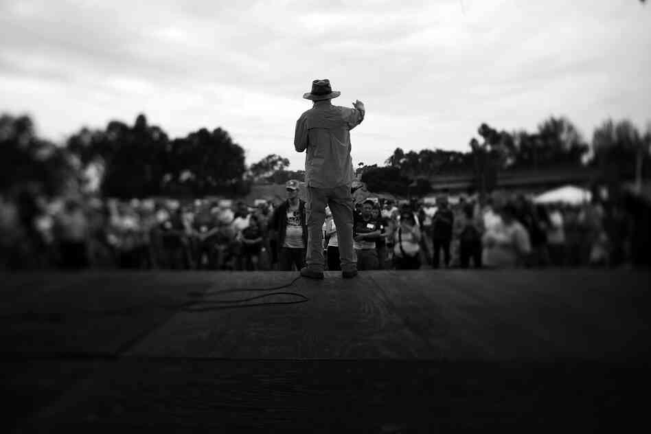 Dr. Jon Nachison speaks during the 25th opening ceremony of the Stand Down event. While the population is mostly from the Vietnam era, newer, younger faces have started to trickle in as vets return from Afghanistan and Iraq.