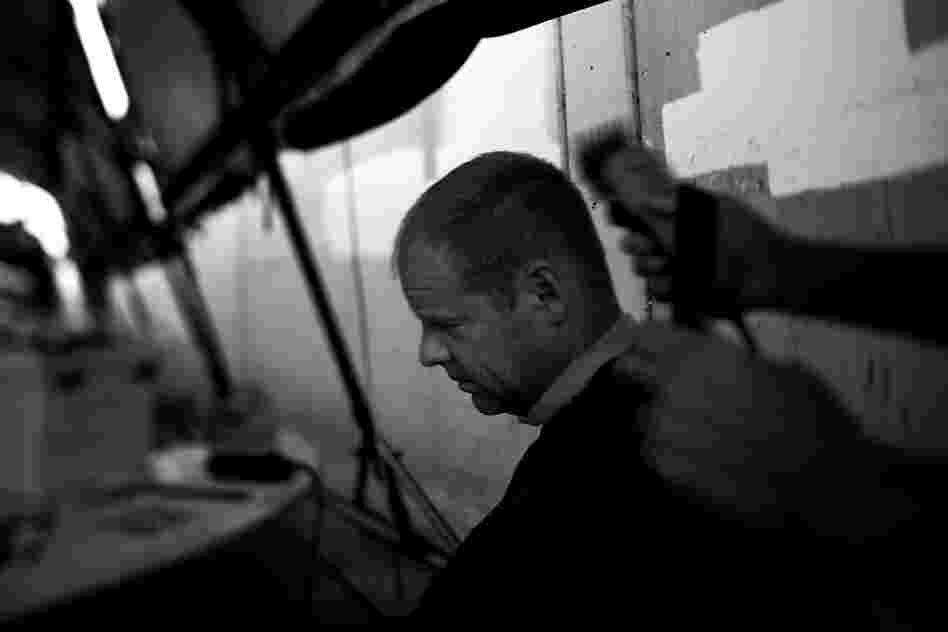 Bob Korchnak, a former Navy battleship sailor, gets a shave and a haircut after traveling from Ohio to take part in Stand Down. Korchnak was arrested numerous times in San Diego for panhandling and came back to take advantage of the court program to deal with outstanding legal issues.