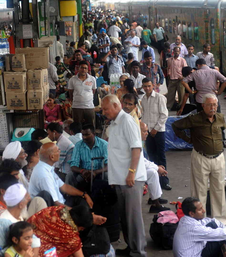 Passengers waited for trains Tuesday at a railway station in New Delhi. Another grid failure cut power, causing chaos.