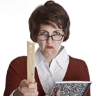 An angry teacher holding a composition book and pointing a ruler.