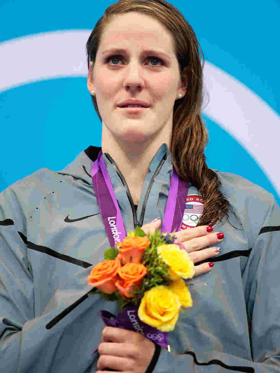 Missy Franklin stands on the podium with her gold medal, after winning the 100m backstroke at the London 2012 Olympic Games. Of that moment, she says, "I was trying to sing, but I was like, crying, at the same time."