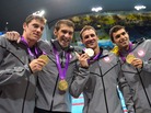 U.S. swimmers Conor Dwyer (left), Michael Phelps, Ryan Lochte, Ricky Berens poses on the podium with their gold medals after winning the men's 4x200m freestyle relay final at the London 2012 Olympic Games. U.S. swimmers Conor Dwyer (left), Michael Phelps, Ryan Lochte, Ricky Berens poses on the podium with their gold medals after winning the men's 4x200m freestyle relay final at the London 2012 Olympic Games.