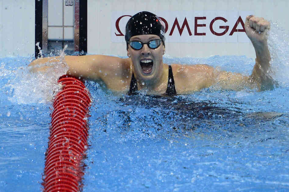 U.S. swimmer Allison Schmitt cheers after winning the women's 200m freestyle final.