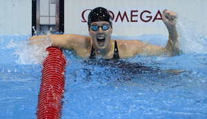 U.S. swimmer Allison Schmitt cheers after winning the women's 200m freestyle final.