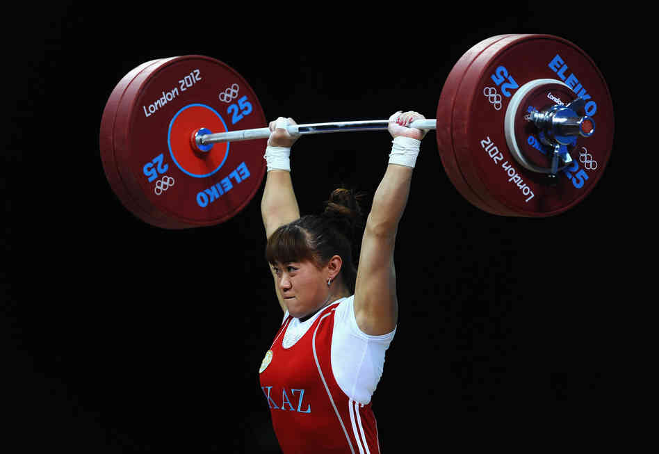 Maiya Maneza of Kazakhstan competes in the Women's 63kg Weightlifting final. She won the event.