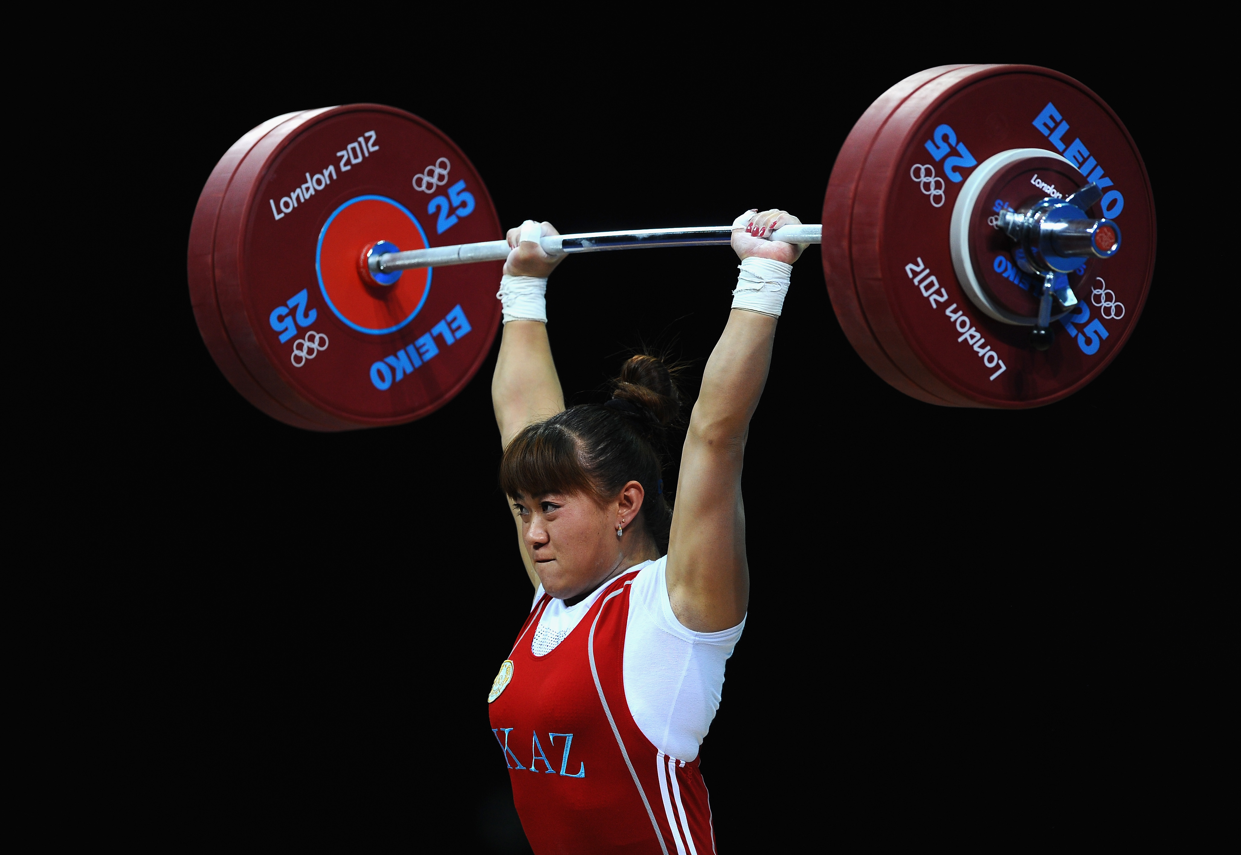 Maiya Maneza of Kazakhstan competes in the Women's 63kg Weightlifting final. She won the event.