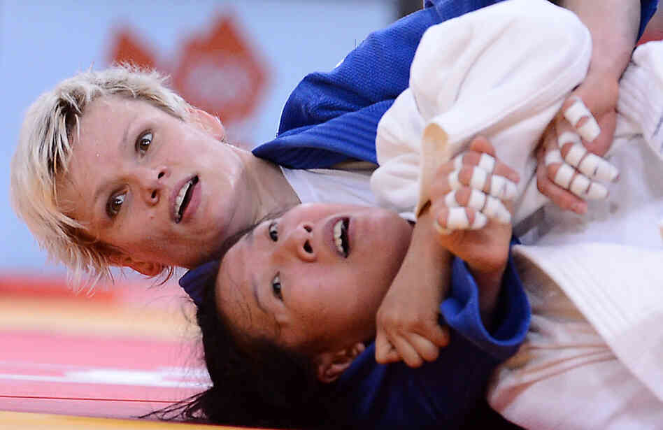 Slovenia's Urska Zolnir (in blue) competes with China's Lili Xu during their women's 63kg judo contest final match. Zolnir won the match.
