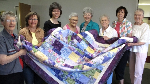 Juanita Ryan (far left), Lori Westphal, Maureen Foster, Othelia Schulz, Karen Pagett, Delores Rosin, Kim Randall, Gladys Pearce. The sewing circle tries to help abused women and children start new lives.