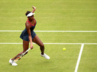 Venus Williams of the United States returns a shot to Aleksandra Wozniak of Canada in their Olympic singles tennis match, played at Wimbledon. Williams won, 6-1, 6-3. Venus Williams of the United States returns a shot to Aleksandra Wozniak of Canada in their Olympic singles tennis match, played at Wimbledon. Williams won, 6-1, 6-3.