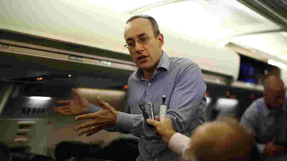 Dan Senor, senior national security aide to Mitt Romney, speaks to the press en route to Israel from London on Saturday.