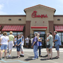 The line stretched into the parking lot today at a Chick-fil-A restaurant in Wichita, Kan.