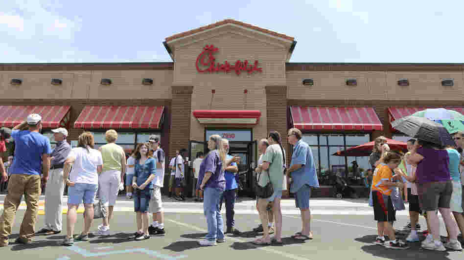 The line stretched into the parking lot today at a Chick-fil-A restaurant in Wichita, Kan.