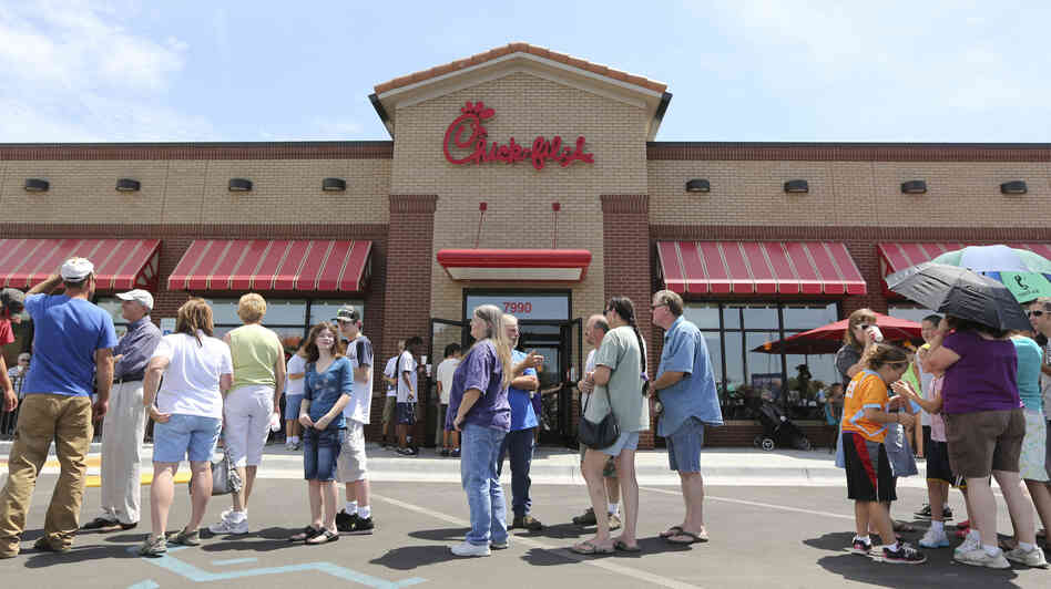 The line stretched into the parking lot today at a Chick-fil-A restaurant in Wichita, Kan.