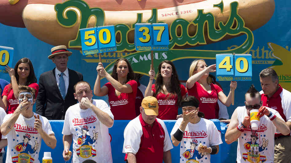 Five-time reigning champion Joey Chestnut, second from left, competes in Nathan's Famous Hot Dog Eating World Championship on July 4 this year.