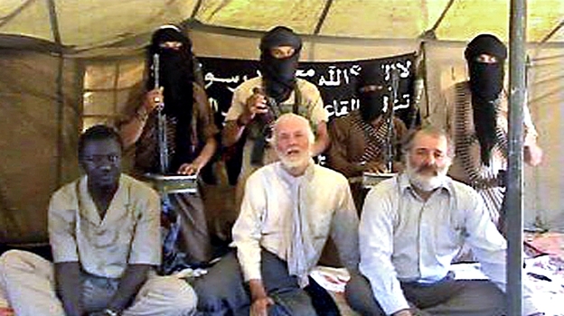 Former Canadian diplomat and U.N. envoy Robert Fowler (center, front row) was kidnapped in 2008 by al-Qaida in the Islamic Maghreb and held for more than four months. He says al-Qaida's recent rise in Mali should be seen as a serious threat to Western interests. Former Canadian diplomat and U.N. envoy Robert Fowler (center, front row) was kidnapped in 2008 by al-Qaida in the Islamic Maghreb and held for more than four months. He says al-Qaida's recent rise in Mali should be seen as a serious threat to Western interests.
