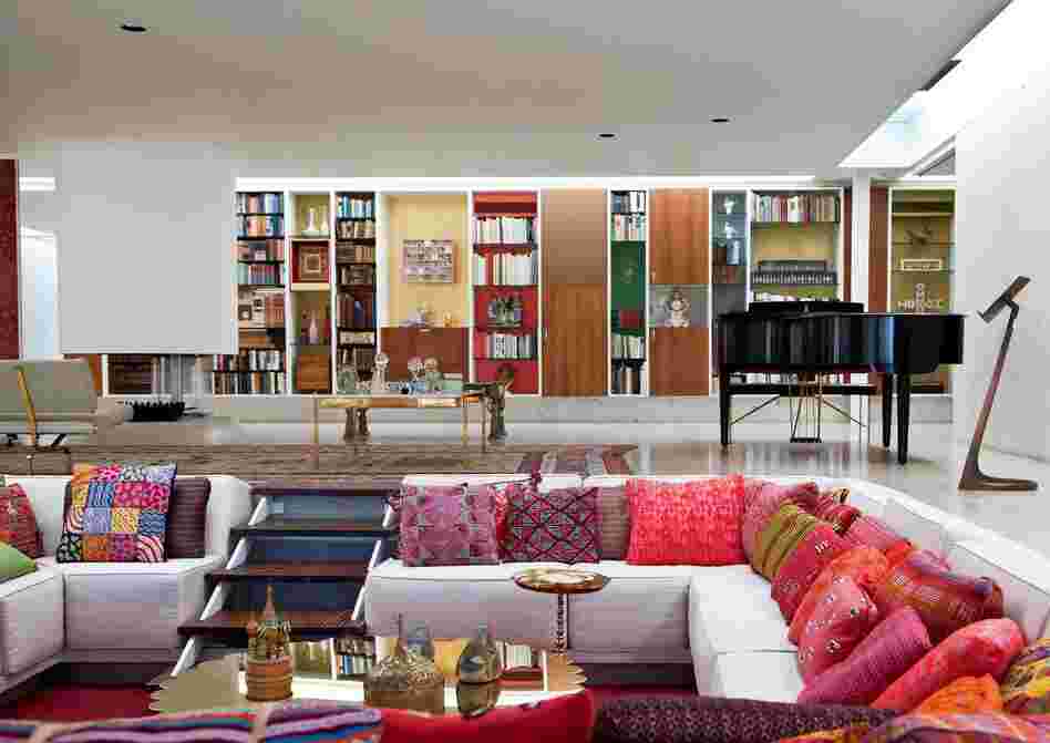 Inside, the sunken "conversation pit" allows for plenty of seating without visual clutter. Architect and designer Alexander Girard worked with Will Miller's mother, Xenia Miller, on the house's interior decoration, which includes a selection of textiles that changes seasonally and a 50-foot-long storage wall.