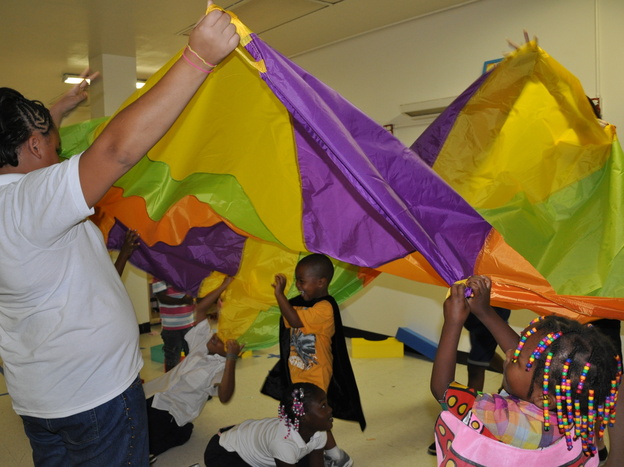 Homeless children have the opportunity to play with volunteers.