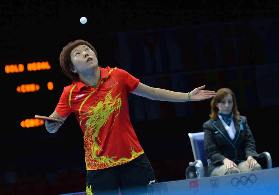 China's Li Xiaoxia serves during her table tennis women's gold medal singles match against her compatriot Ding Ning. Li won the event.