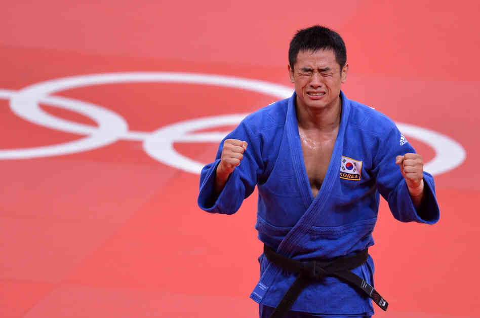 South Korea's Song Dae-Nam celerates after winning the men's 90kg judo contest final match.