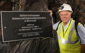 Businessman and philanthropist T. Denny Sanford has pledged $70 million to the Sanford Underground Science and Engineering Laboratory. He stands next to a plaque dedicating the 4,850 foot level, where several experiments will be set up, in 2009. Businessman and philanthropist T. Denny Sanford has pledged $70 million to the Sanford Underground Science and Engineering Laboratory. He stands next to a plaque dedicating the 4,850 foot level, where several experiments will be set up, in 2009.