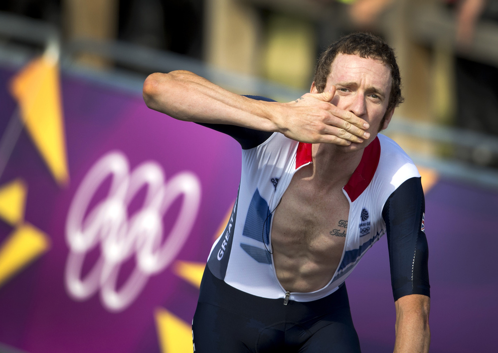 Britain's Bradley Wiggins celebrates after winning the gold medal at the end of the London 2012 Olympic Games men's individual time trial road cycling event in London.