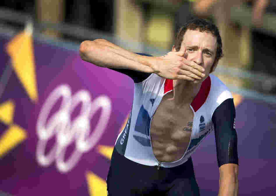 Britain's Bradley Wiggins celebrates after winning the gold medal at the end of the London 2012 Olympic Games men's individual time trial road cycling event in London.