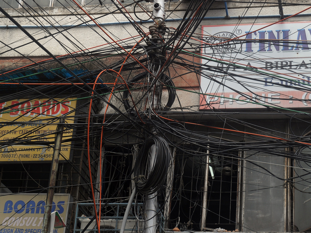 Plenty of wires. But where's the juice? This electric pole in Kolkata is typical of many in heavily populated India.