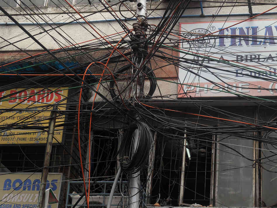 Plenty of wires. But where's the juice? This electric pole in Kolkata is typical of many in heavily populated India.