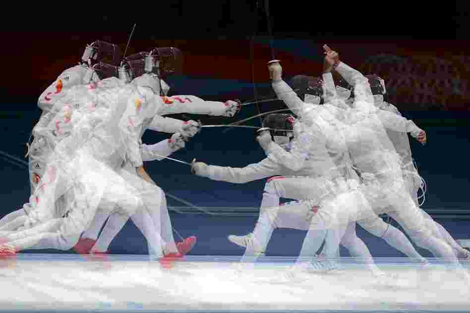 China's Lei Sheng (left) competing against Italy's Andrea Baldini during the men's fencing semi-final