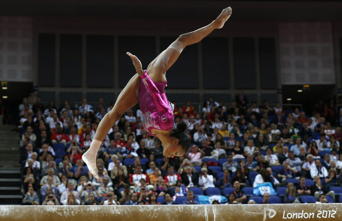 Gabrielle Douglas performs Thursday on the beam during the artistic gymnastics women's individual all-around final. Some people are focusing on her hair rather than her skill.