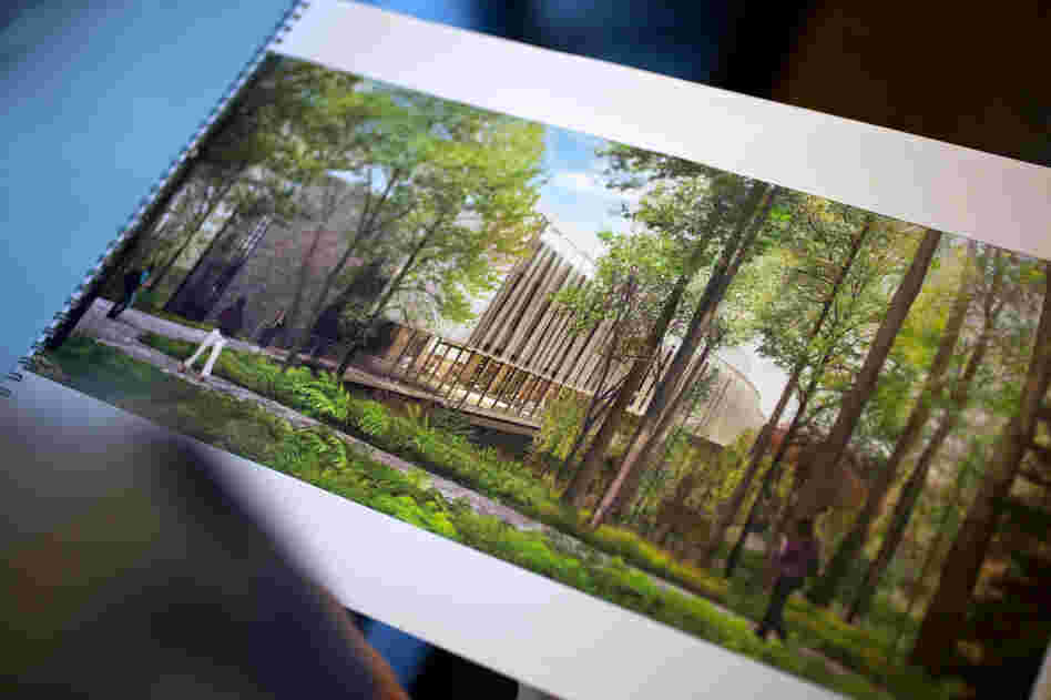 Architect Guy Maxwell holds a printout of his proposed design for the new Bridge Building at Vassar College in Poughkeepsie, N.Y.
