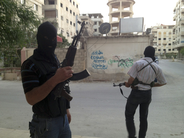 Members of the Free Syrian Army are seen in a neighborhood of Damascus, Syria on June 28. Several huge suicide bombings this year suggest al-Qaida or other extremists are joining the battle against President Bashar Assad's regime.
