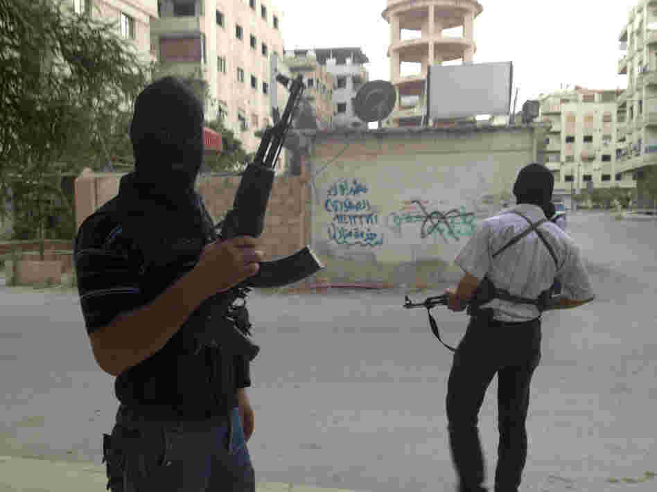 Members of the Free Syrian Army are seen in a neighborhood of Damascus, Syria on June 28. Several huge suicide bombings this year suggest al-Qaida or other extremists are joining the battle against President Bashar Assad's regime.