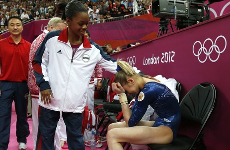 After Thursday's competition, American Gabby Douglas consoles silver medalist Victoria Komova of Russia. After Thursday's competition, American Gabby Douglas consoles silver medalist Victoria Komova of Russia.