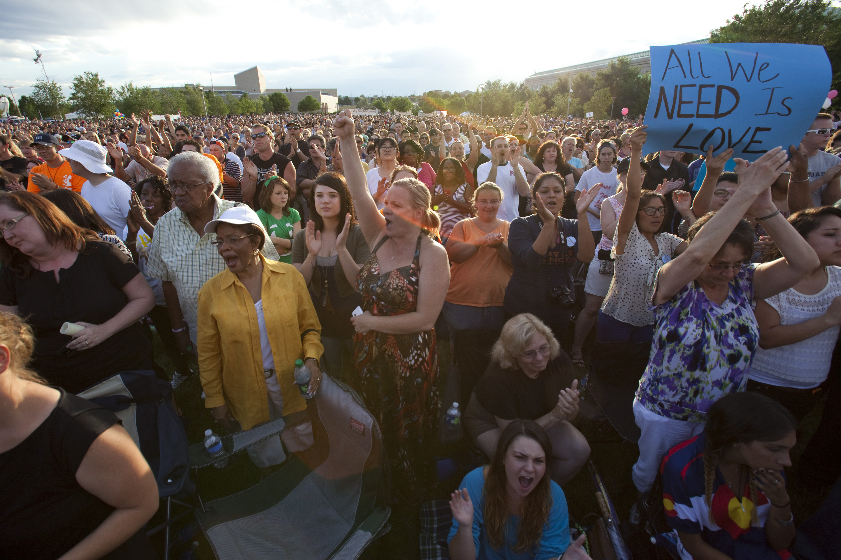 Thousands gather during a vigil for the shooting victims at the Aurora Municipal Center on July 22.