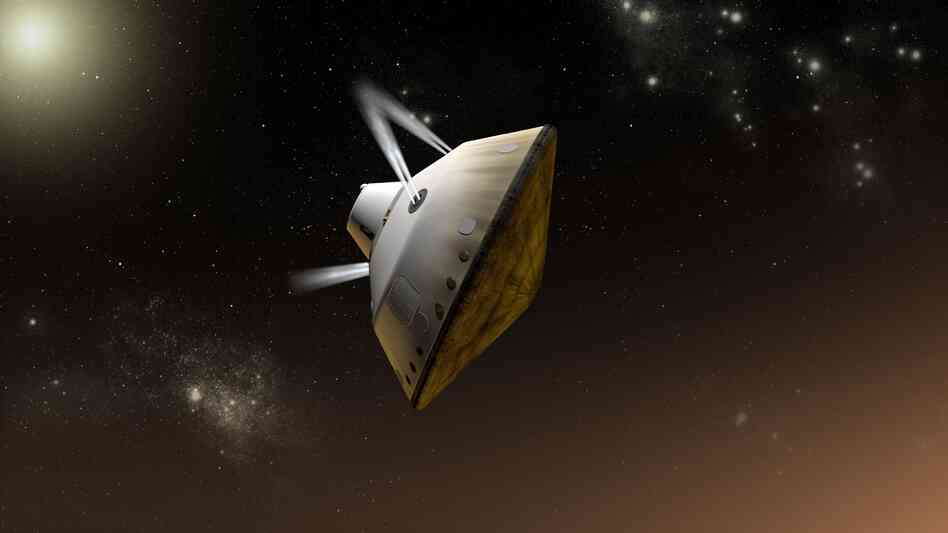 This artist's concept shows thrusters firing to steer the spacecraft as it enters Martian atmosphere. The Curiosity rover has traveled for more than seven months inside the spacecraft.