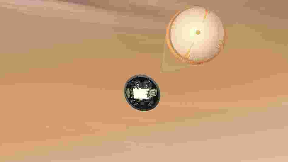 A parachute more than 50 feet across pops out, adding a bit more braking as the craft sinks into Mars's lower atmosphere.