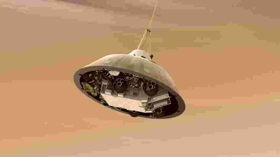 With the heat shield jettisoned, the rover can be seen tucked into the backshell of the spacecraft.