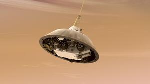 With the heat shield jettisoned, the rover can be seen tucked into the backshell of the spacecraft.