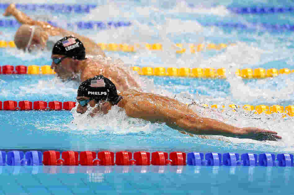 U.S. swimmers Michael Phelps (bottom) of the United States and Ryan Lochte (center) compete in the Men's 200m Individual Medley final on Day 6 of the London 2012 Olympic Games.. Phelps placed first and Lochte placed second.