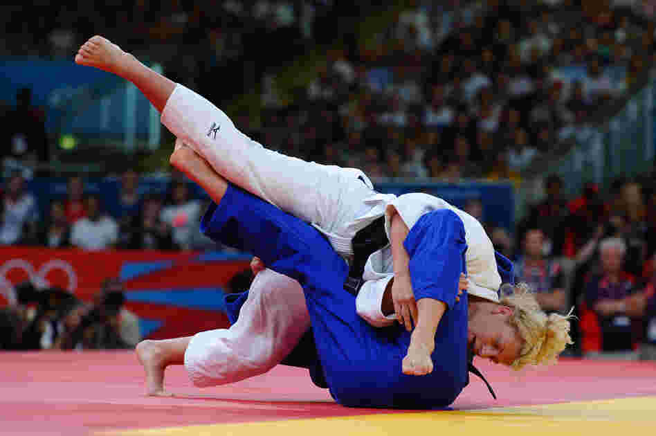 Kayla Harrison of the United States (in white) and Gemma Gibbons of Great Britain compete in the women's 78 kg judo.