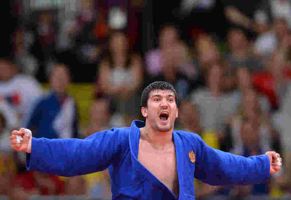Russia's Tagir Khaibulaev celebrates after winning the men's 100kg judo contest final match.