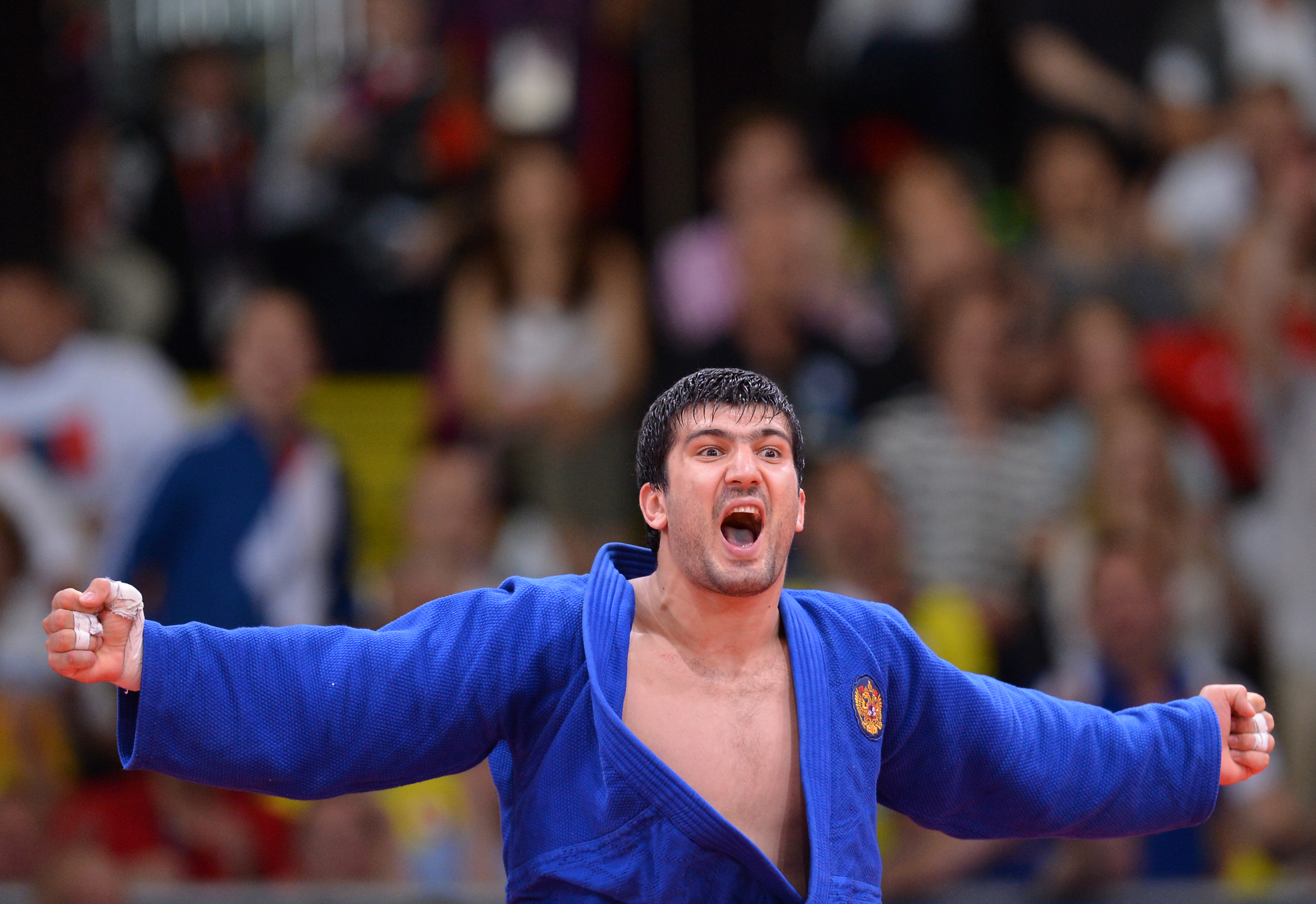 Russia's Tagir Khaibulaev celebrates after winning the men's 100kg judo contest final match.