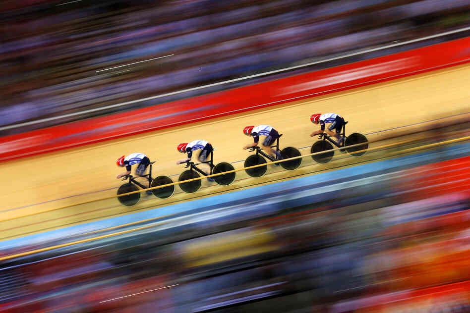 Great Britain posts a new world record time during Men's Team Pursuit Track Cycling Qualifying event.